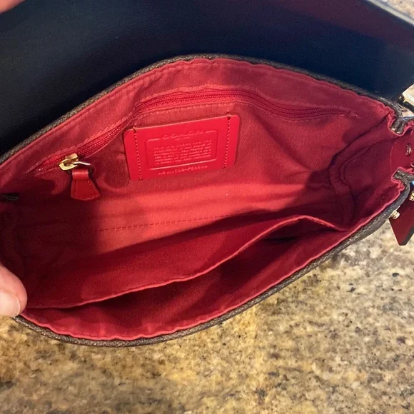 This is a like new coach cross body bag. - Picture 9 of 9